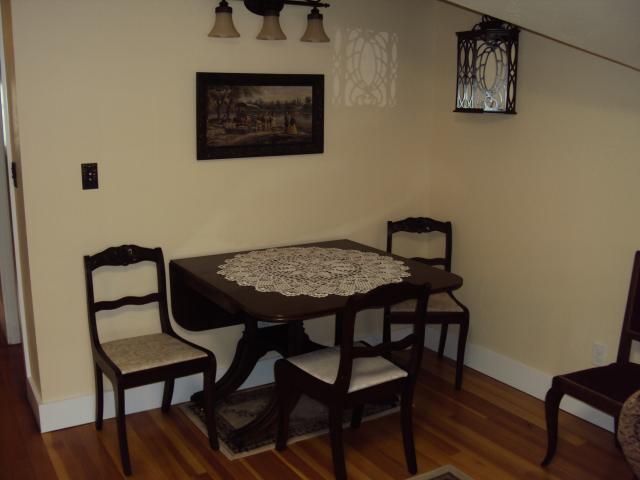 A table against the wall in the Cambridge House