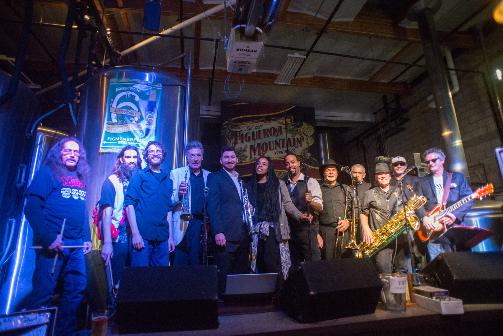 The Soul Cats Band posing on stage after a show