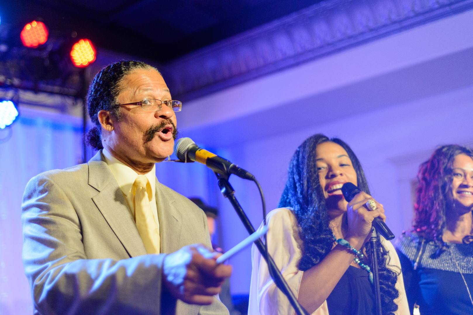 A singer singing into a microphone